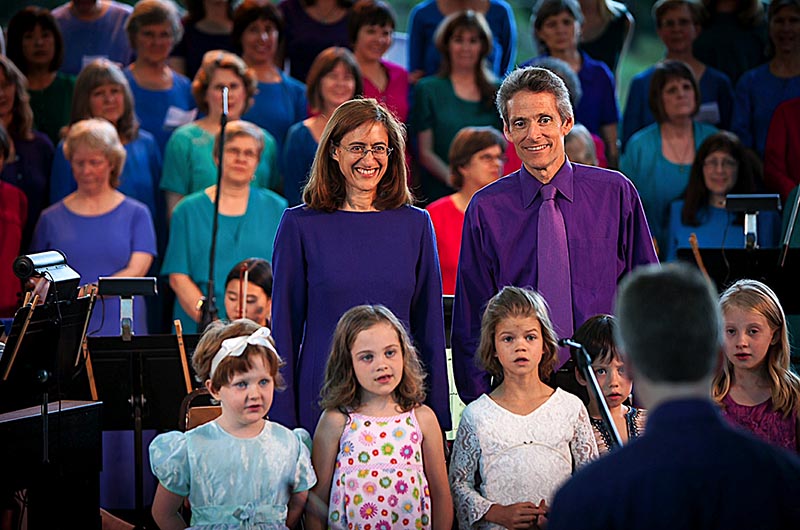 <em>Dambara and Karen G sing “Larks Fly High” with young vocalists during a concert at Ananda Village.</em>